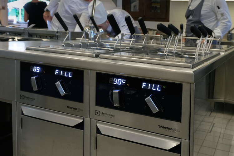 Close-up of Electrolux Professional cooking range in use at Grand Hotel Excelsior Vittoria professional kitchen