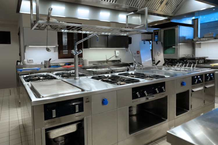 Modern stainless steel cooking islands and Electrolux Professional equipment at Grand Hotel Excelsior Vittoria