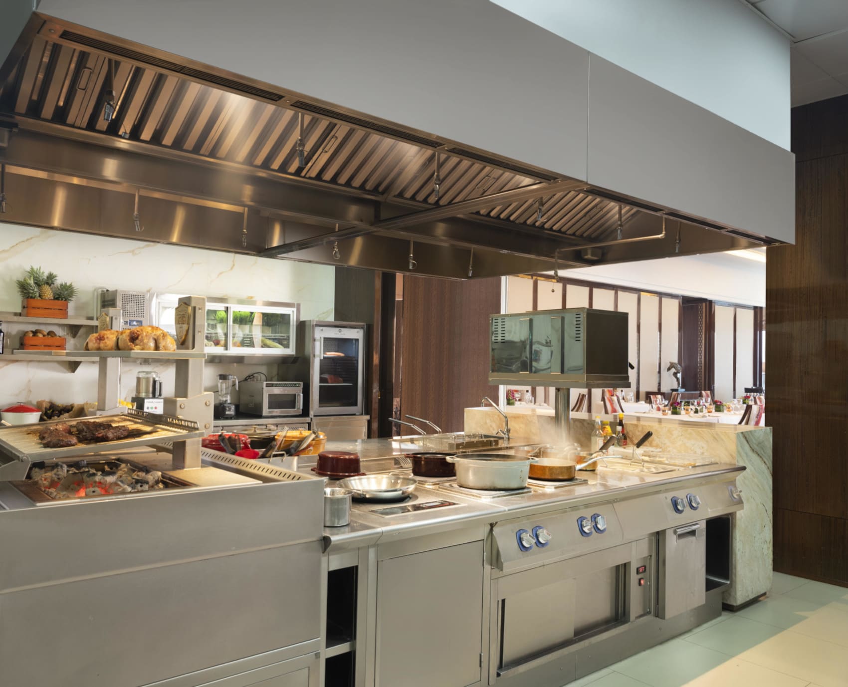 Wide view of stainless steel professional kitchen at Raffles Hotel Jakarta equipped with Electrolux Professional appliances