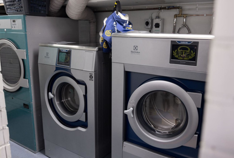 Electrolux Professional front-loading washing machines installed in modern laundry facility