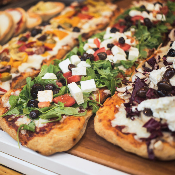 Case With Assortment Of Different Tasty Pizza In The Shop